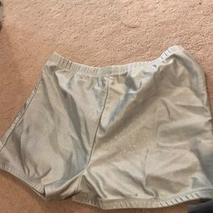 Shiny gray spandex shorts.